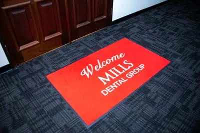 doormat welcoming you to Mills Dental Group
