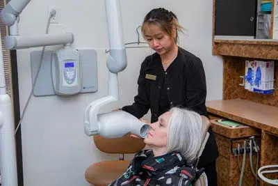 woman receiving dental x-rays at Mills Dental Group in Houston, TX